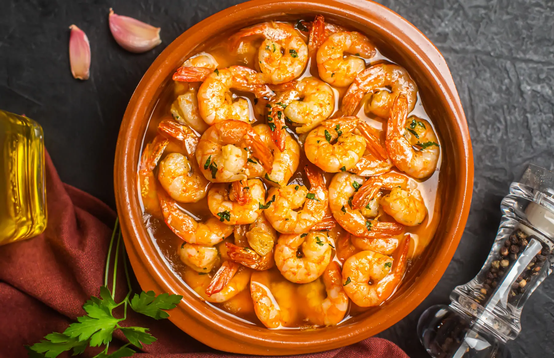 Garlic prawns in a clay dish
